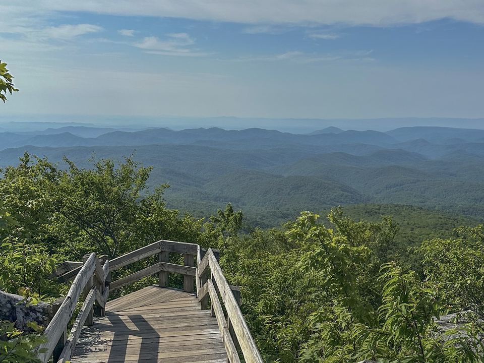The wooden boardwalk at Rough Ridge with Blue Ridge ridgelines beyond